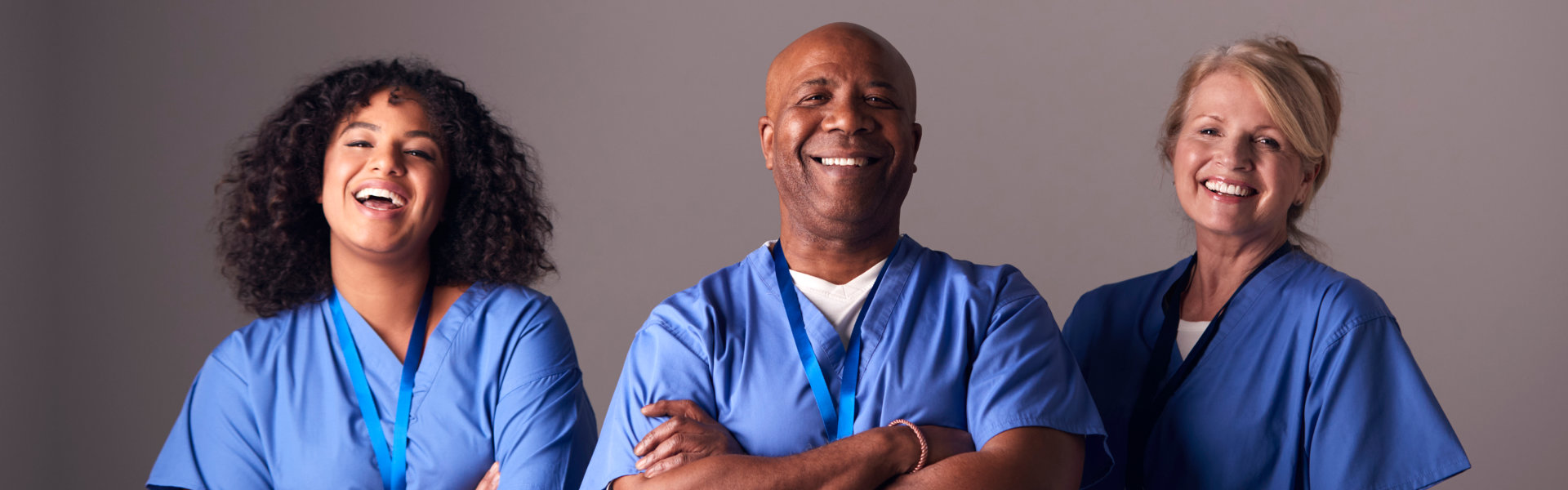 three healthcare workers smiling