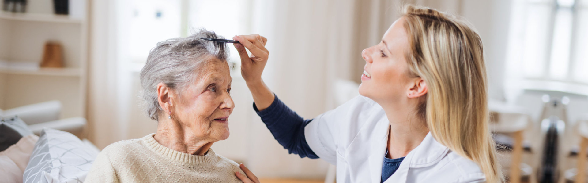 nurse combing senior