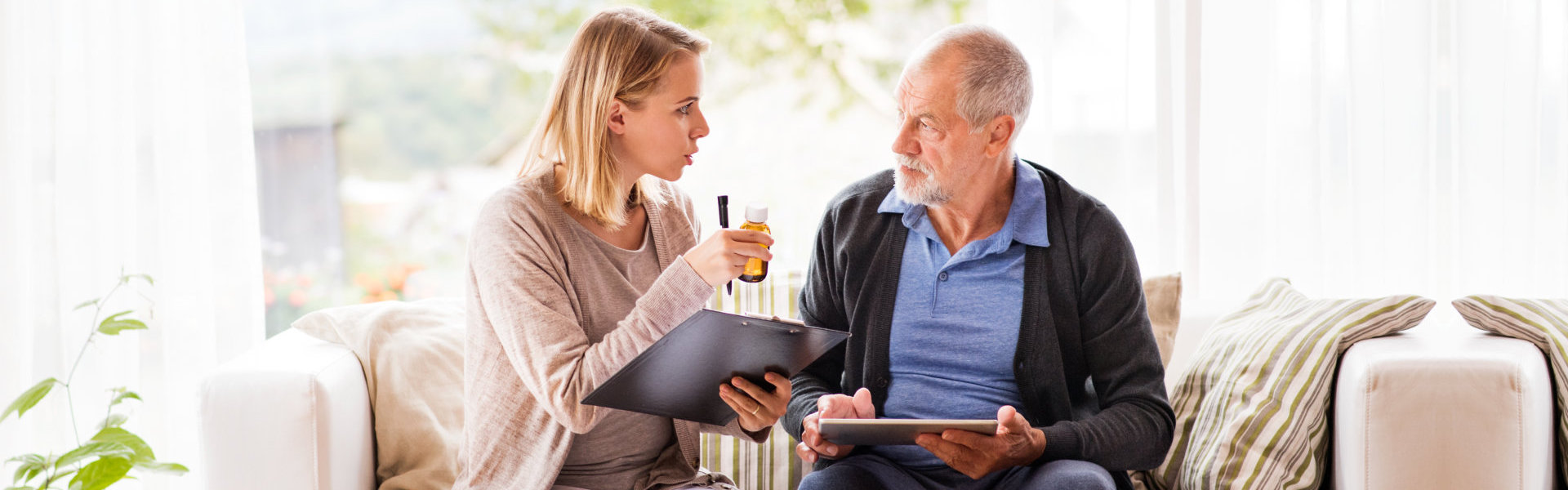 nurse giving senior medicines